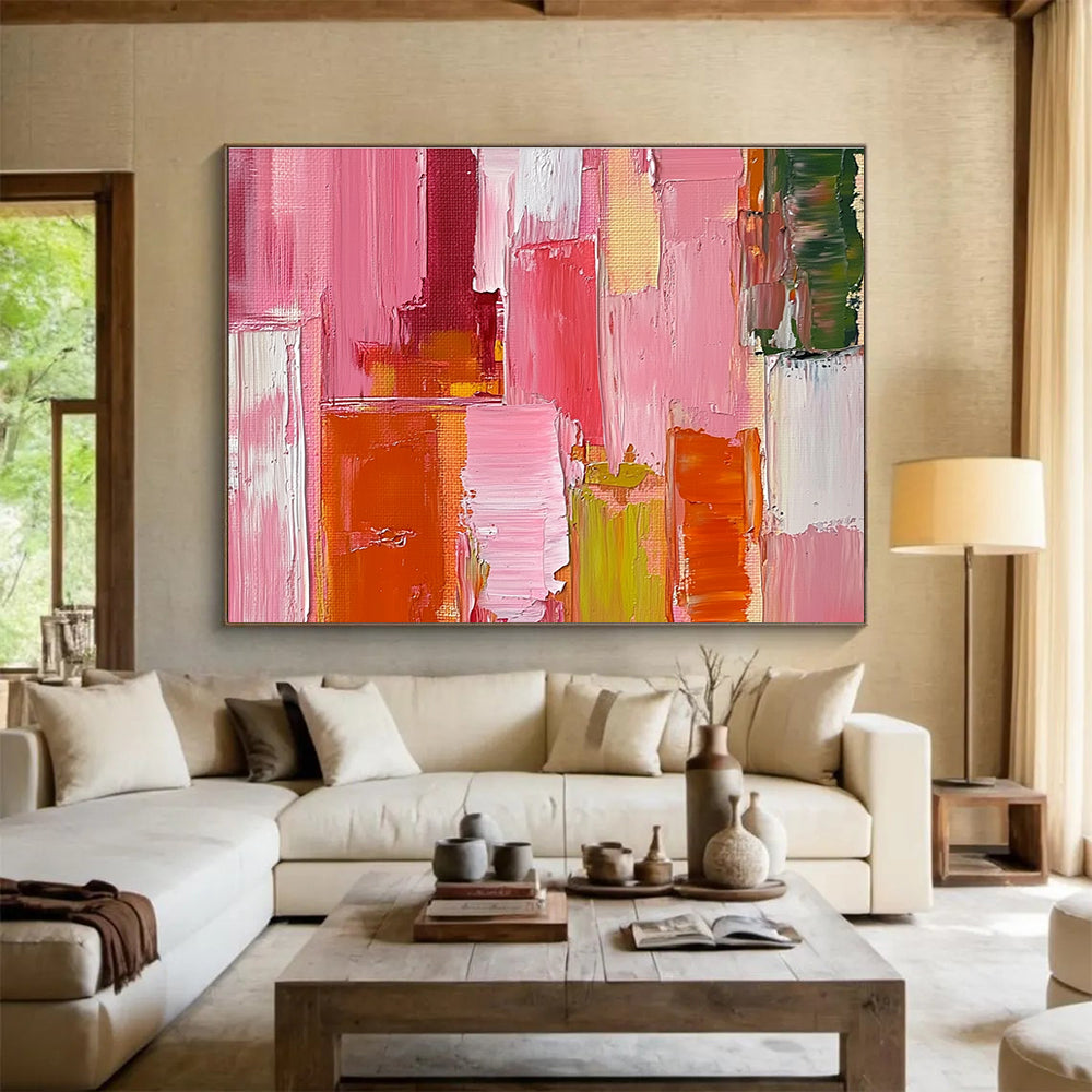 Large abstract oil painting featuring a pink orange and red cityscape with thick brush strokes and a soft impressionist style.SC118