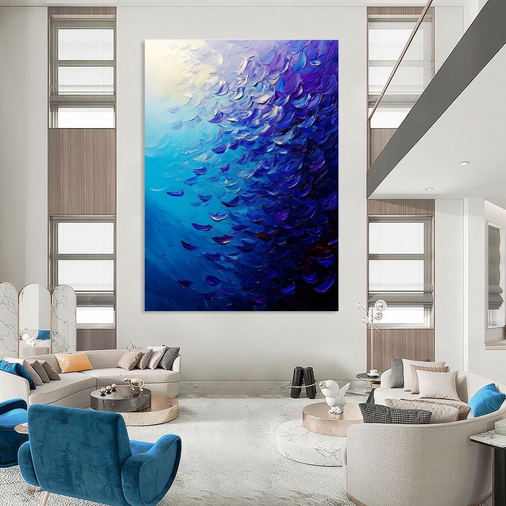 Large abstract painting of a vibrant ocean filled with fish in deep blue and purple hues featuring dynamic brush strokes and rich impasto texture.STSC866