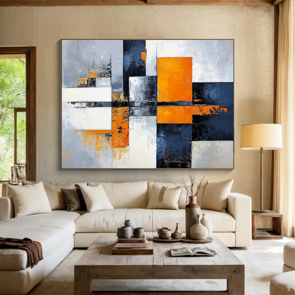 Large abstract painting featuring gray, white, and orange color blocks with a calming cityscape background, offering a sense of harmony and balance.SC100