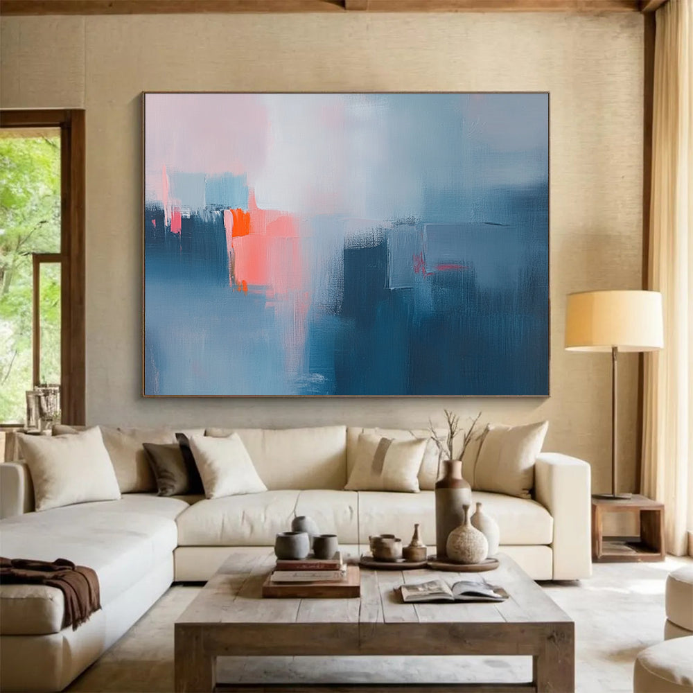 Large abstract oil painting depicting a misty rain with blue and grey hues highlighted by pink and orange accents.SC319