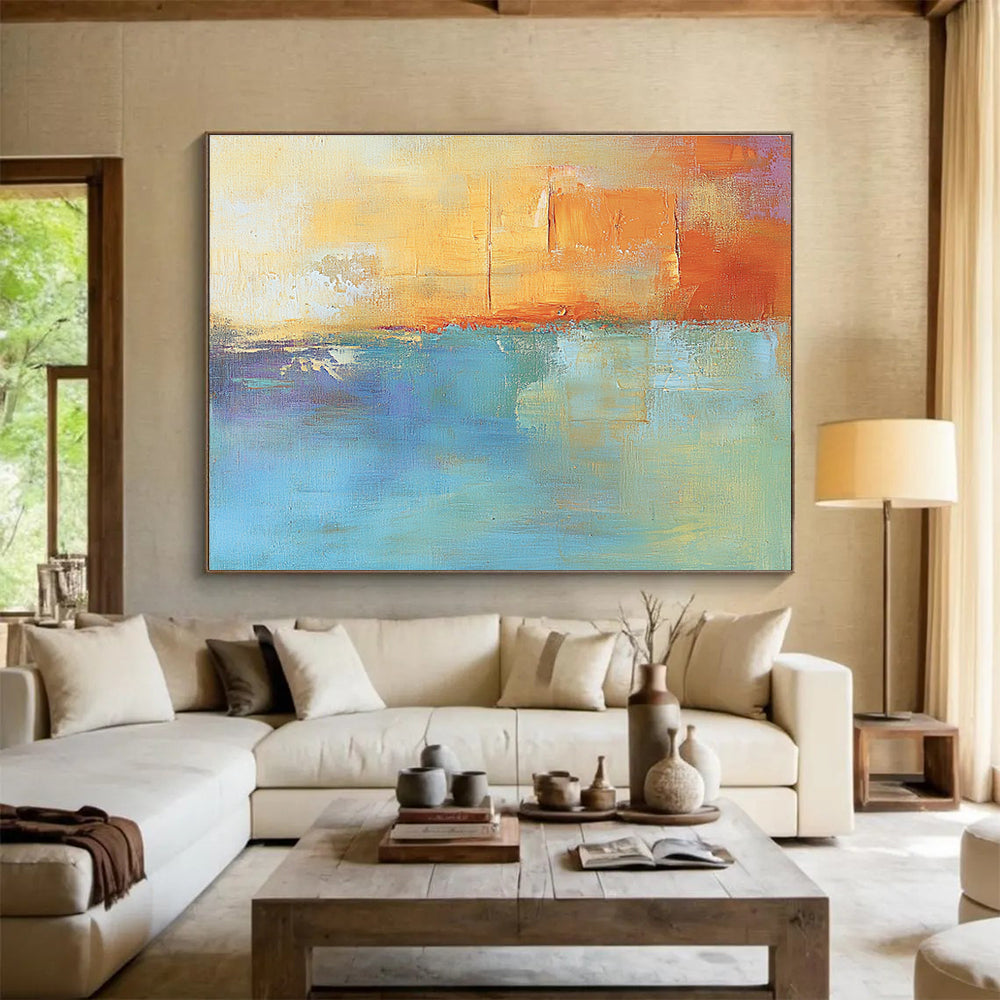 Large abstract oil painting in muted orange and aqua with soft shapes and blurred edges evoking calmness and tranquility through its impressionist style.SC124