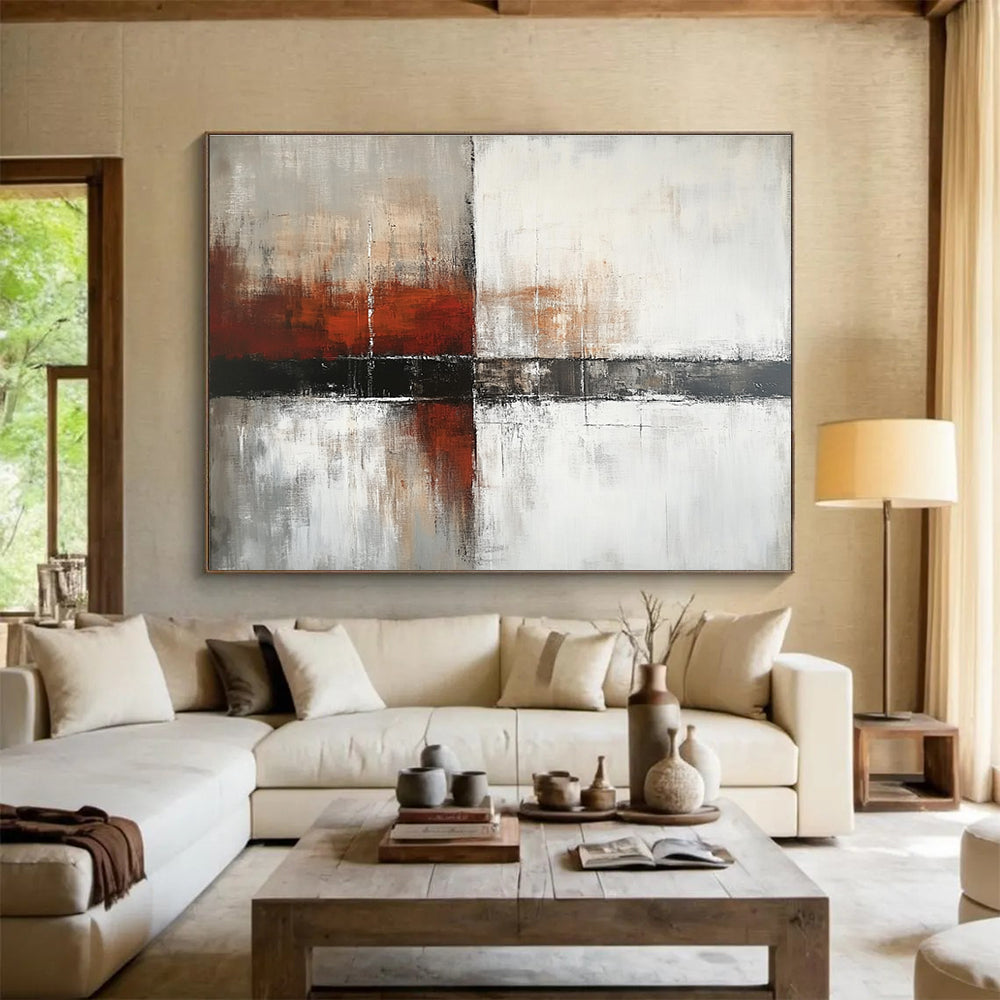 Large abstract painting with a calming color palette of white gray and soft tones featuring dark red orange brushstrokes and textured layers.SC592