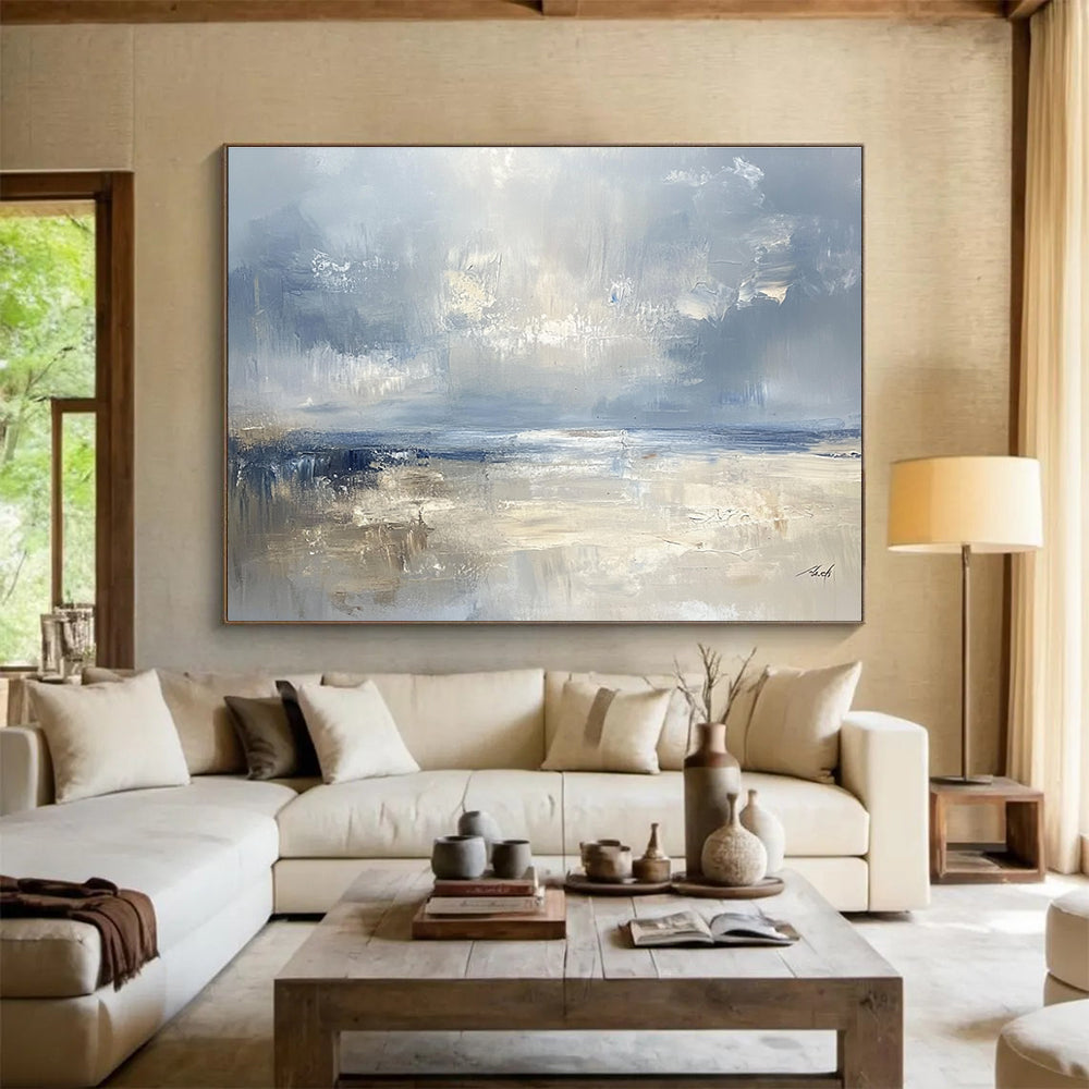 Large abstract seascape in cool blues and grays with warm beige accents capturing serene coastal beauty and a misty horizon.SC278
