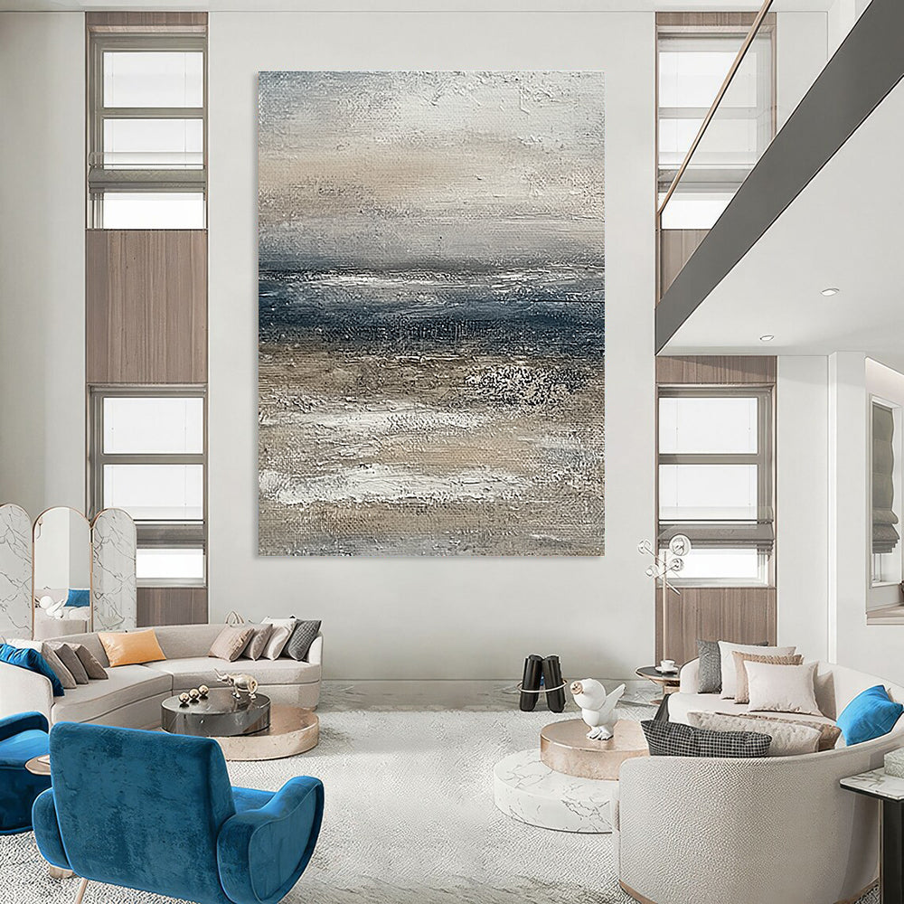 Large abstract painting of the ocean featuring muted beige and grey tones with a soft textured effect on canvas.STSC833