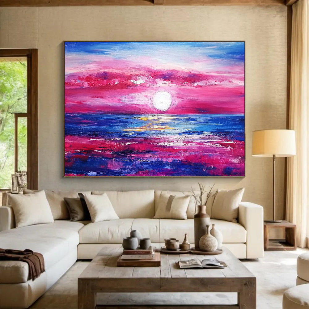 A large abstract painting featuring a pink and blue sunset over the ocean with purple and red clouds by artist Anna Bocek.SC537