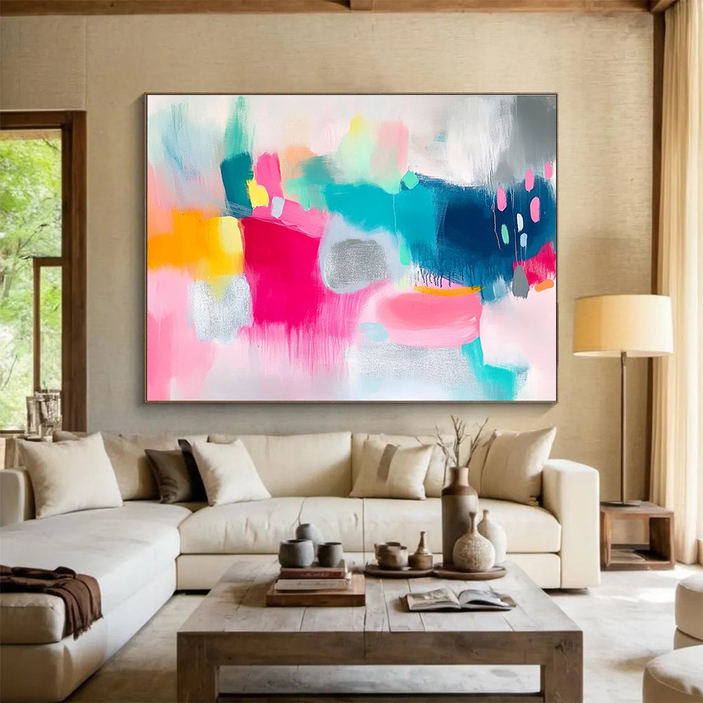Large abstract painting featuring vibrant pink and teal shapes on a white background with bold brush strokes and shimmering silver foil accents.SC215