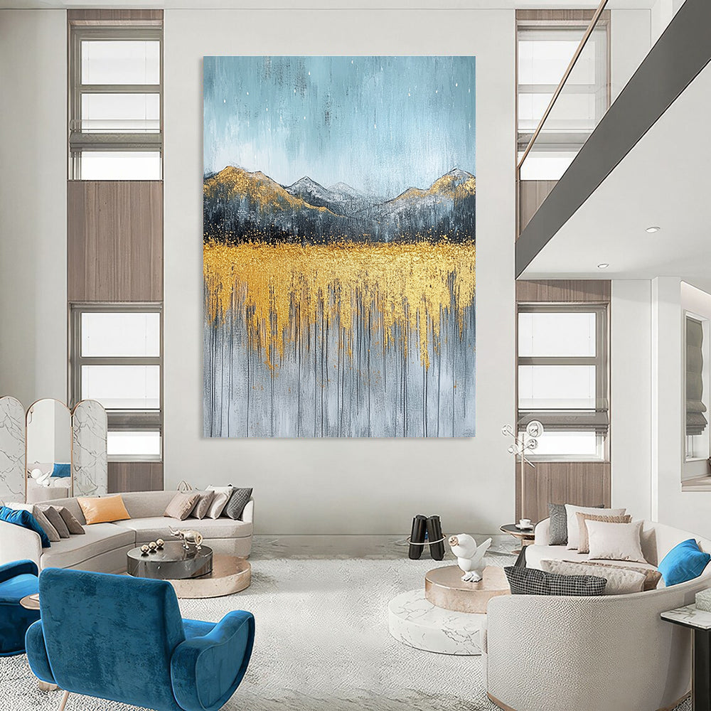Large abstract painting with gold and silver on textured canvas featuring a serene sky golden mountains and soft gray grass.STSC097