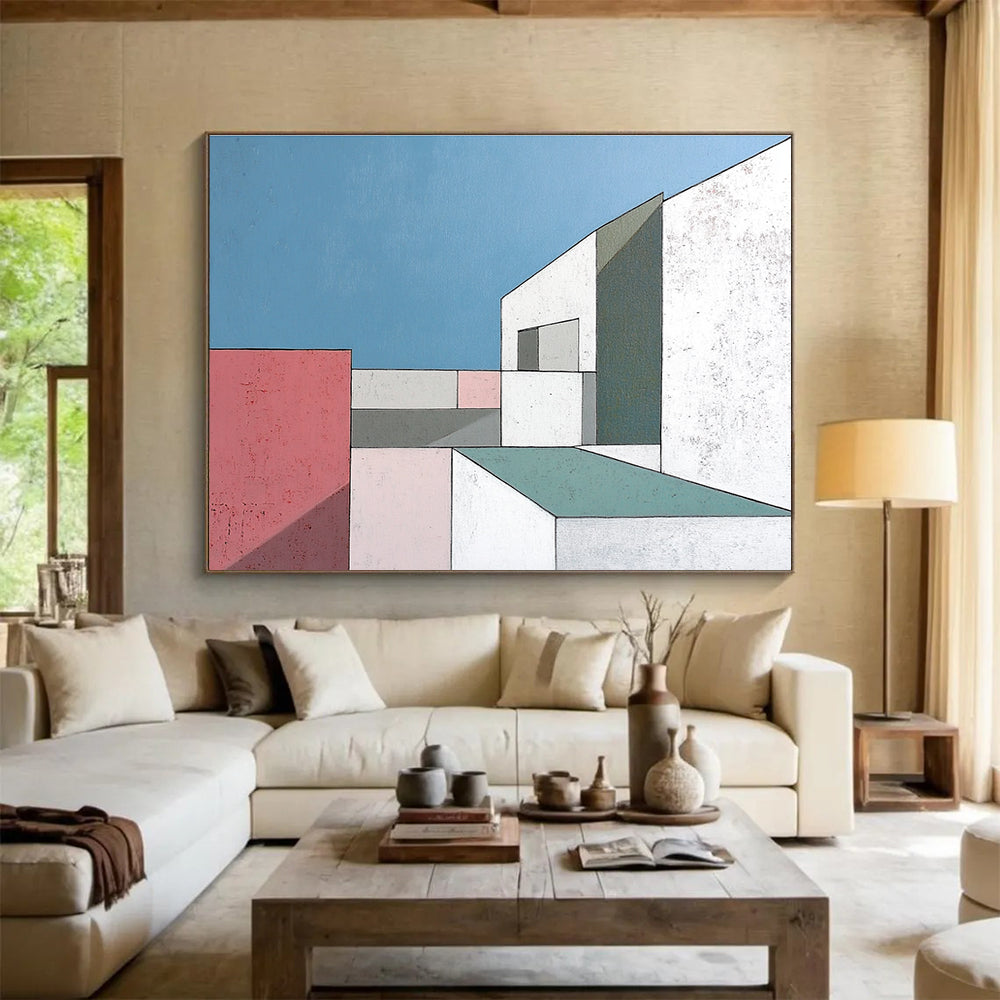 A large abstract painting featuring minimalist white buildings with large windows against a serene blue sky highlighting sharp color contrasts and geometric shapes.SC487