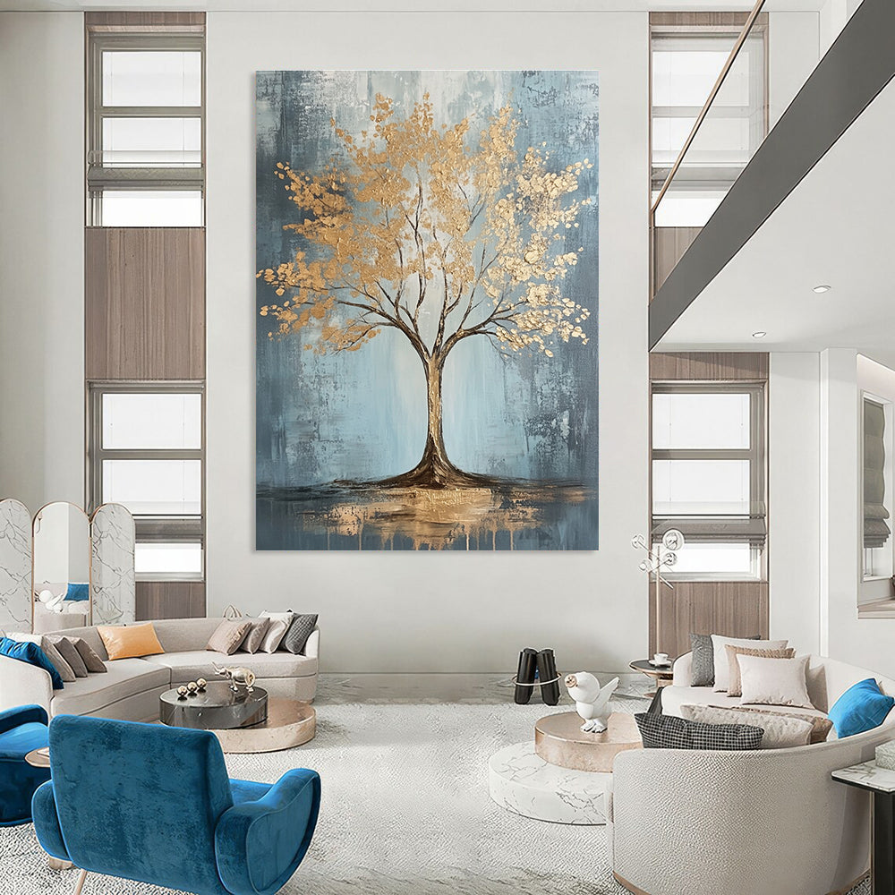 Large abstract painting with gold leaf accents on grey and light blue textured canvas featuring dynamic brush strokes and warm lighting, embodying sophisticated bohemian style.STSC493