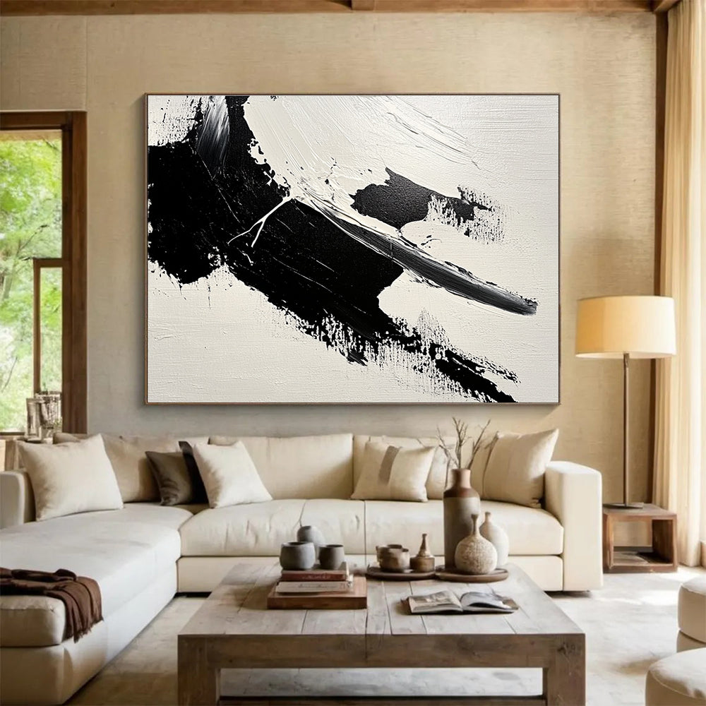Large abstract painting featuring bold brushstrokes and textured areas of black and gray on a minimalist white background.SC574