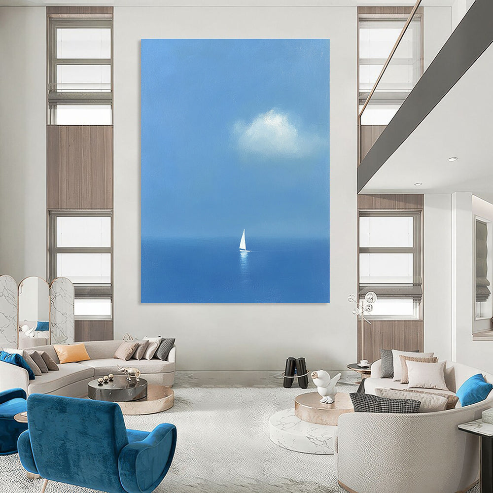 Large abstract painting featuring a white sailboat on the sea in light blue and indigo colors creating a dreamy atmosphere with ethereal clouds.STSC1255