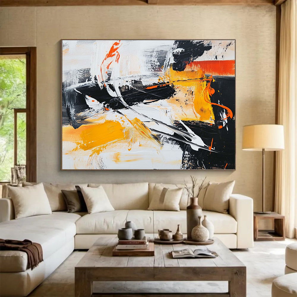 Large abstract painting in black white and orange featuring vibrant yellow brush strokes for a dynamic artistic touch.SC142