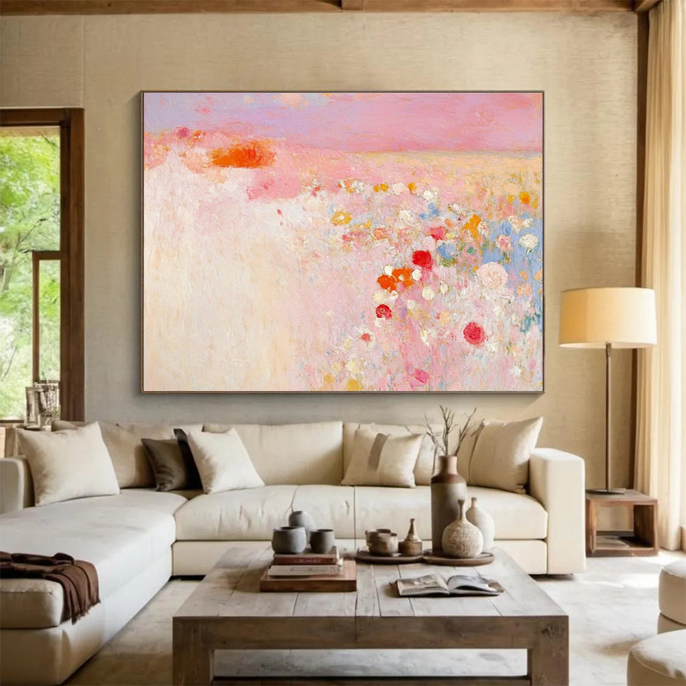 Large abstract painting in soft pink and white with hints of red and yellow evokes springtime calmness amidst a blooming field.SC350