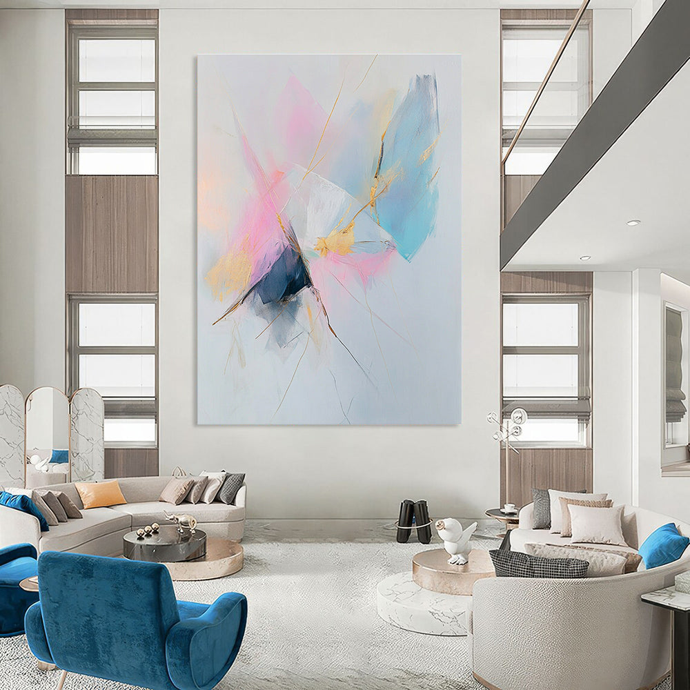 Large abstract painting featuring pastel pink and blue tones with gold accents on a white background creating a serene and calming atmosphere.STSC783