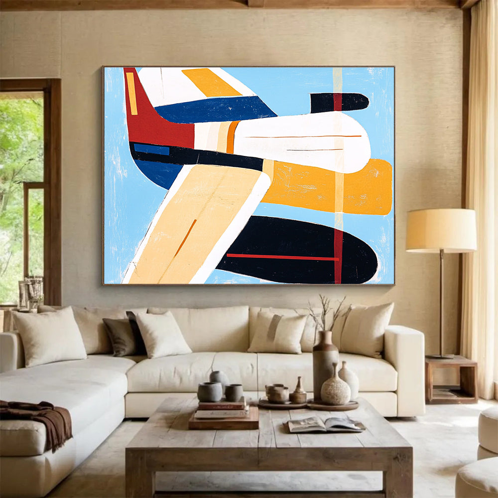 Large abstract painting of an airplane with bold lines and vibrant colors including blue, red, yellow, and orange in the style of Mary Blair.SC040