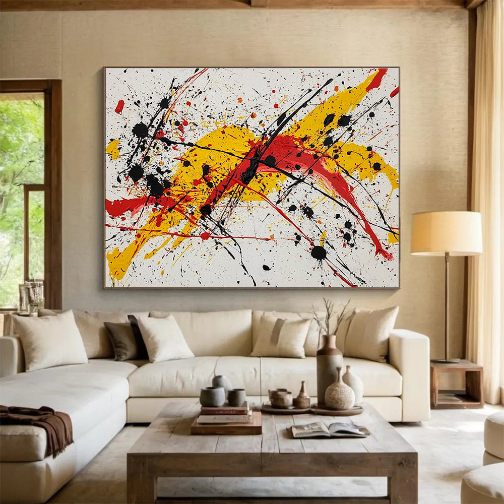 Large abstract painting featuring vibrant red yellow and black splashes evoking energy and freedom through dynamic brushstrokes and harmonious chaos.SC570