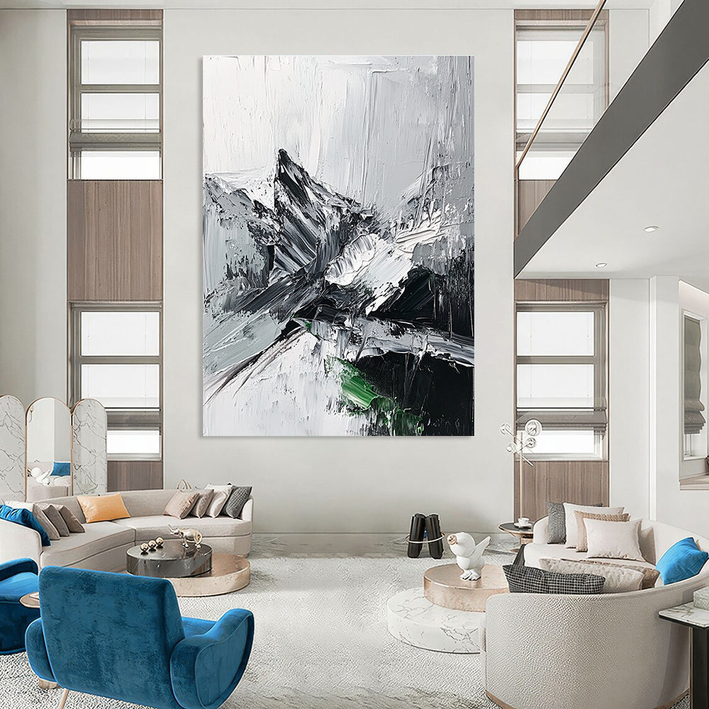 Large abstract painting featuring impasto technique with thick black and white strokes depicting a misty mountain range and a small patch of snow.STSC427