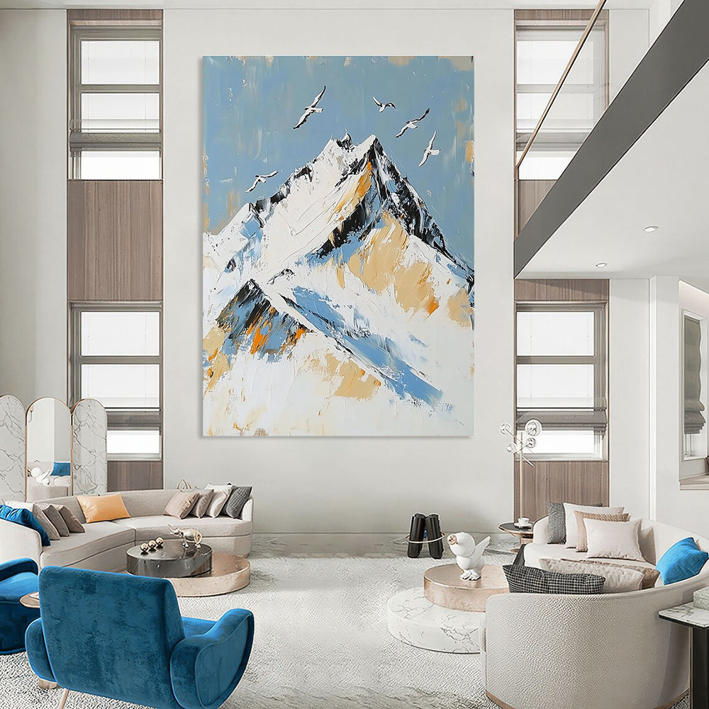 Large Abstract Painting featuring Snowy Mountain Peak with Birds in Flight accented with Gold in Elegant White and Blue Tones.STSC1365