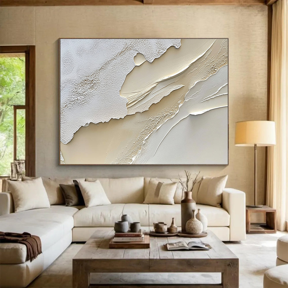 An abstract painting featuring a textured cream-colored surface reminiscent of sand dunes in soft white and beige tones.SC459