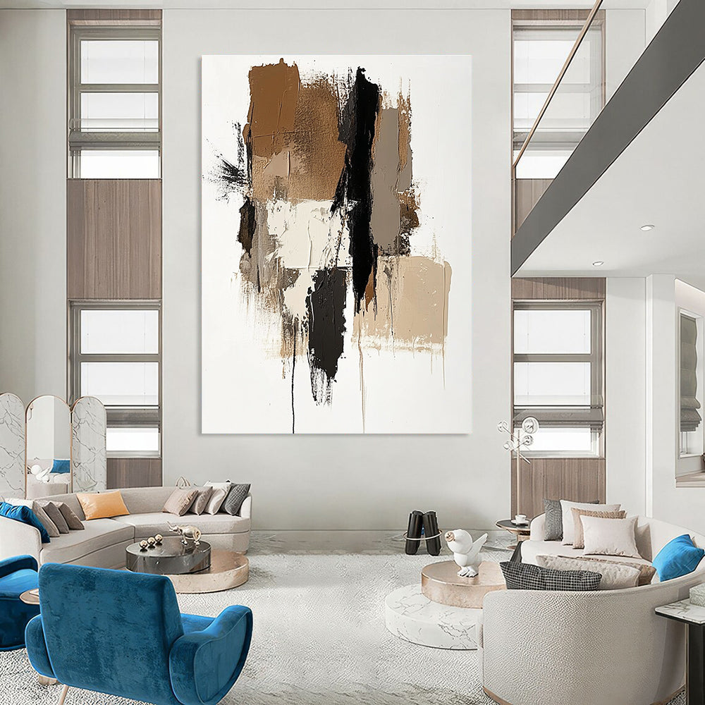 Large abstract painting featuring brown beige and white colors with a prominent gray shape and vertical navy blue detail.STSC677