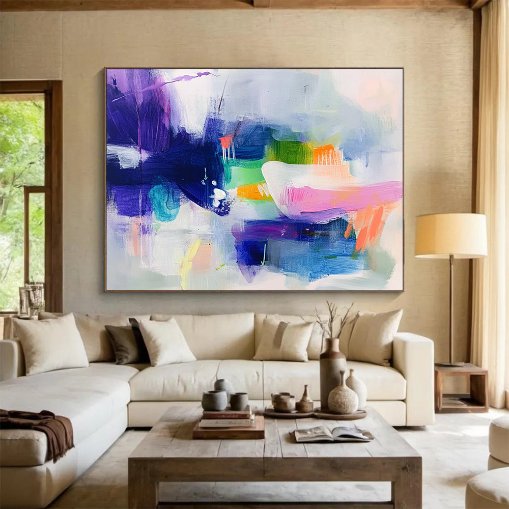 Large abstract painting featuring cool colors with soft shapes suggesting houses and flowing water creating a serene dreamy atmosphere.SC342