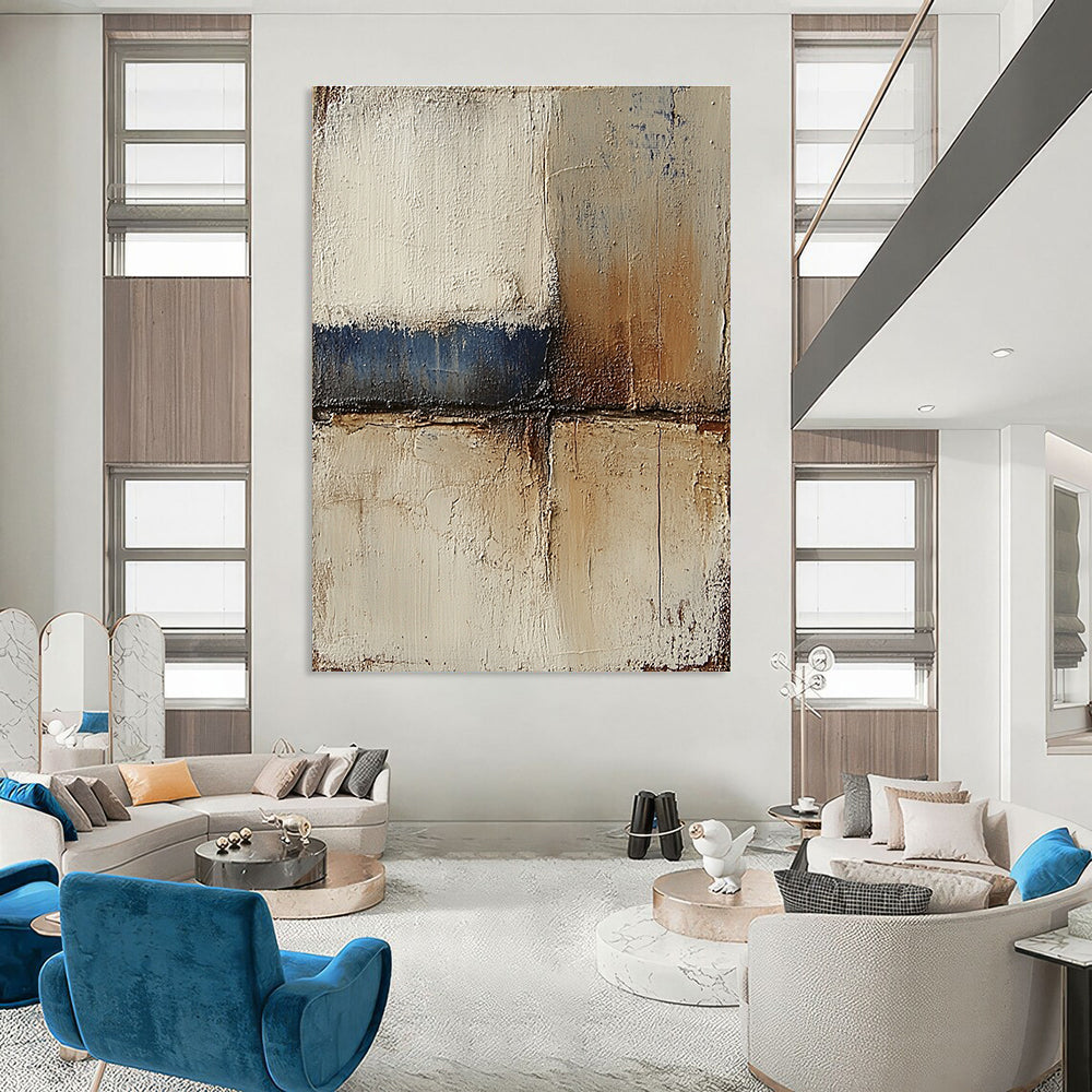 Abstract landscape with neutral colors in earth tones of beige and brown accented by blue textured paint ideal for modern decor.STSC079