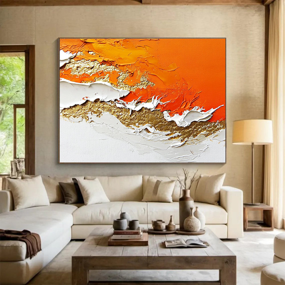 A large abstract painting with layers of orange and white enhanced by gold details and rich texture.SC325