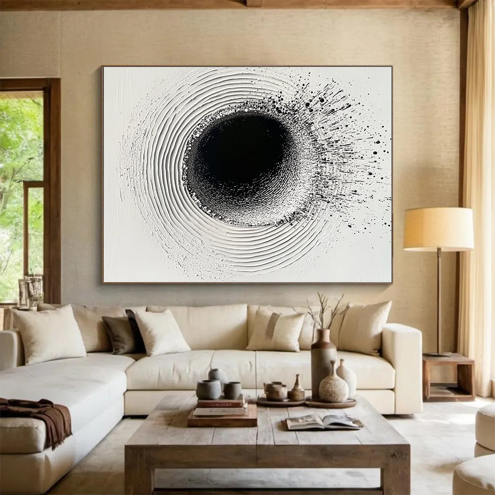 An abstract painting featuring a circular hole filled with water droplets creating ripples on a white plaster background with black ink lines.SC435