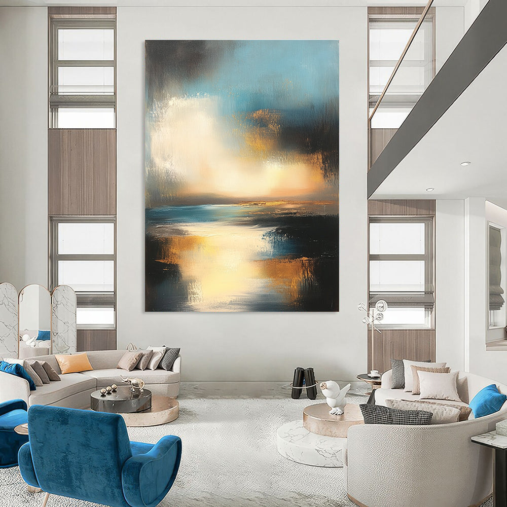 Large abstract oil painting depicting the ocean and sky at sunset with muted colors and gold accents for a serene ambiance.STSC196