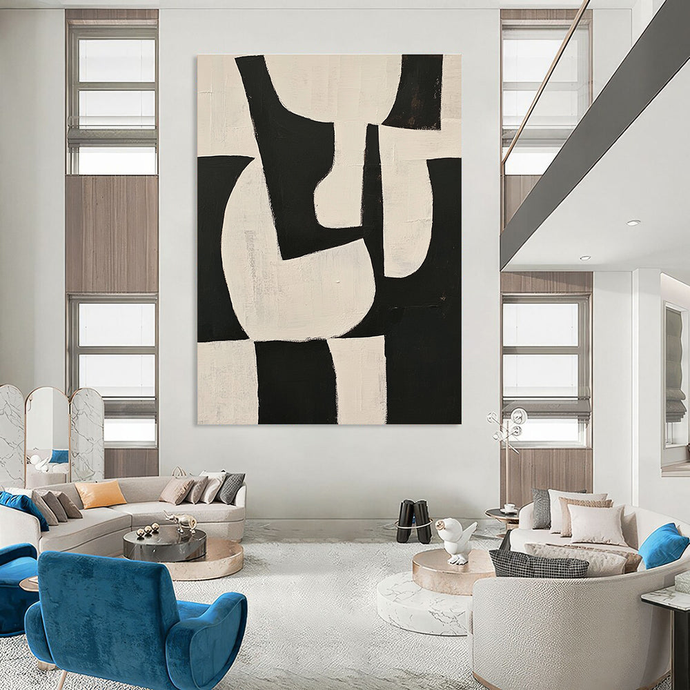Large abstract painting featuring black and white shapes on a beige background with organic forms and overlapping lines for depth and elegance.STSC329