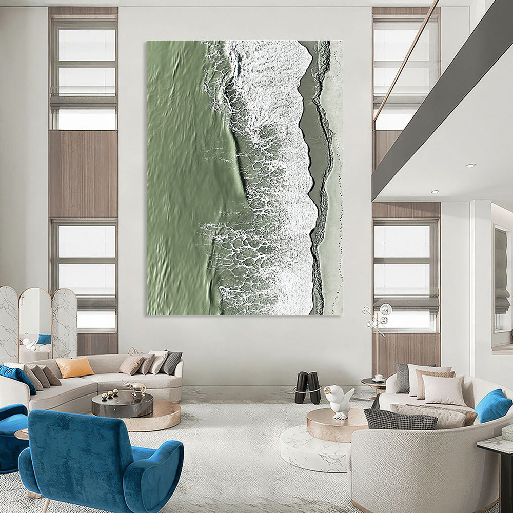 A large abstract painting capturing the serene edge where sand meets water in green and grey tones with rolling waves.STSC1158