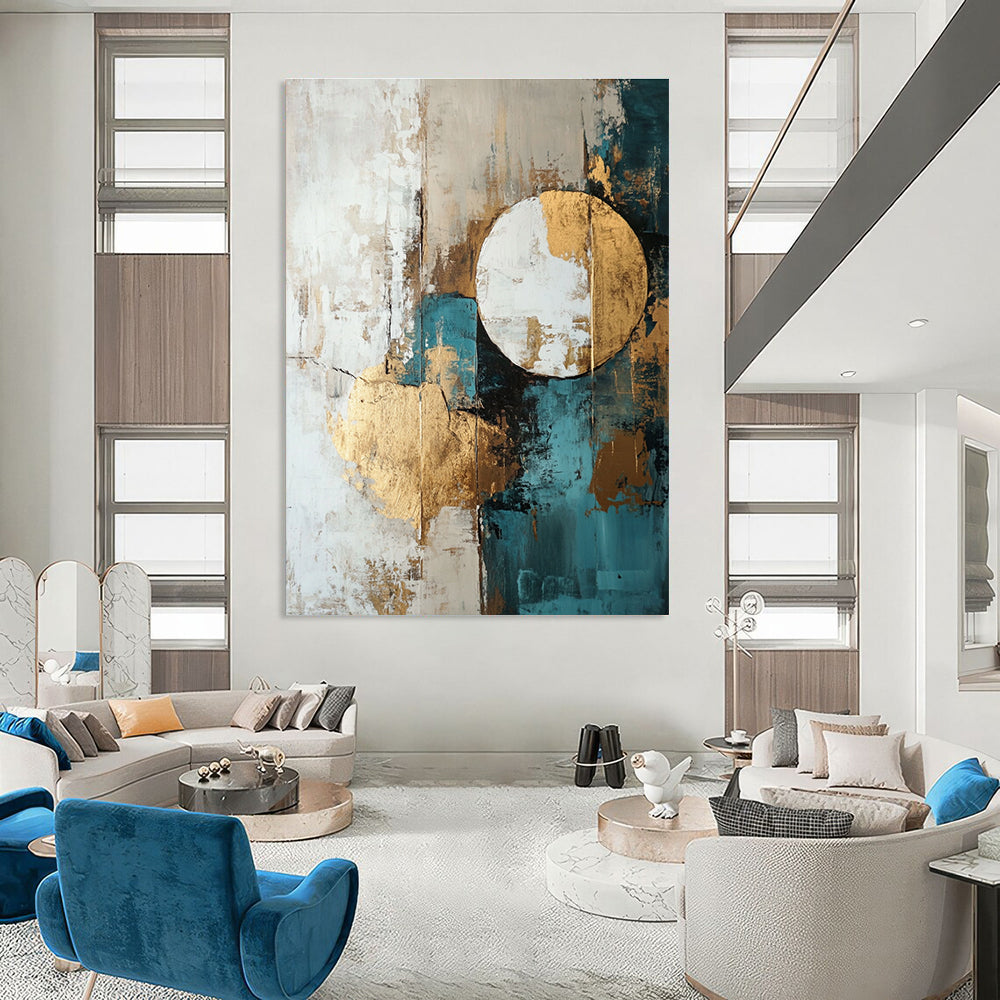 Large abstract painting featuring shapes and lines in white beige teal blue and brown with gold foil accents.STSC193