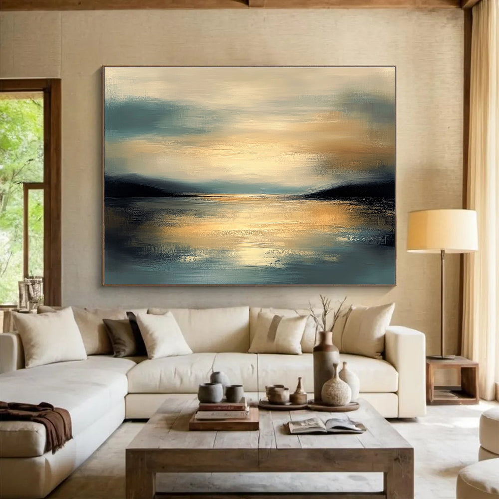 Large abstract painting featuring muted colors and calm water reflecting a detailed sky during golden hour with a serene atmosphere and gentle brushwork.SC064