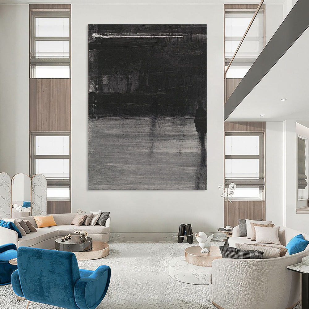 Large abstract painting featuring deep gray tones bold brushstrokes and a mysterious atmosphere with soft lighting and striking light shadow contrasts.STSC910