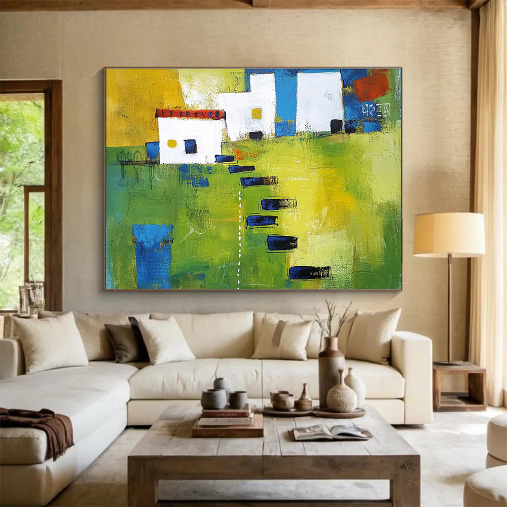 Large abstract painting showcasing green fields, white buildings with blue lines, and black stairs, featuring thick brush strokes and vibrant geometric shapes.SC193