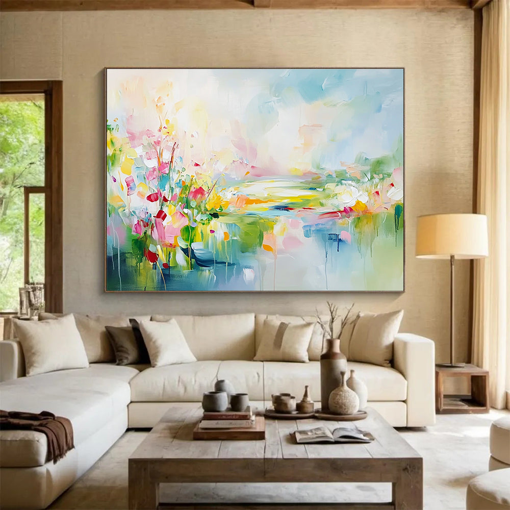 Large abstract landscape painting featuring spring flowers in a colorful meadow with a flowing river vibrant greenery and a serene sky.SC084