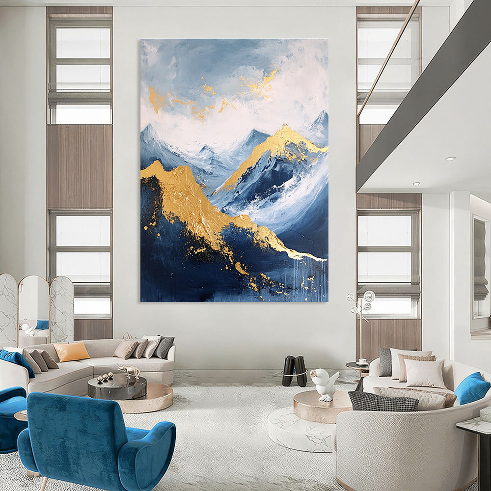 Large abstract painting featuring a golden mountain against a blue sky with white clouds and dark grey stone tones accented with gold.STSC013