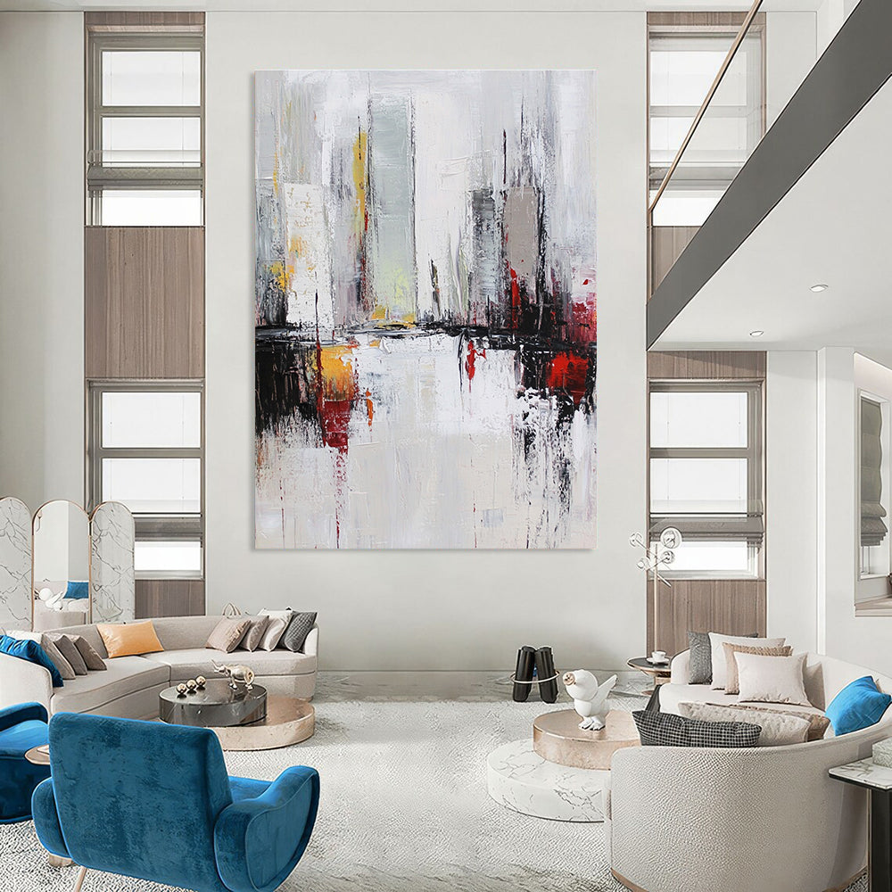 Large abstract oil painting of a cityscape in white and grey tones with red accents featuring dynamic loose brush strokes.STSC162