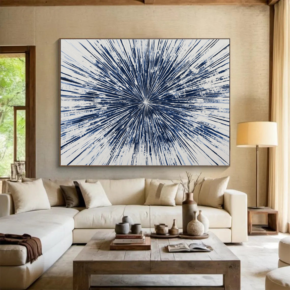 Large abstract painting featuring a blue starburst design with intricate radiating lines, creating a vibrant and energetic composition on a white background.SC430