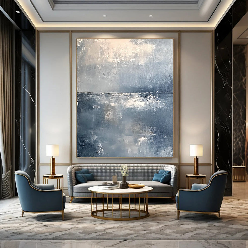 Large abstract painting of a serene ocean horizon in muted gray and white tones with soft brushstrokes conveying tranquility and elegance.STSC262