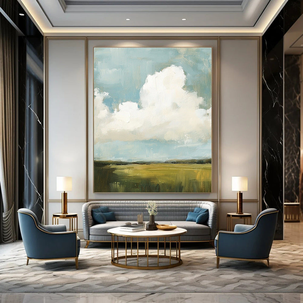 Large abstract painting featuring fluffy white and gray clouds over green grass fields with visible brush strokes and muted colors, creating a detailed scene.STSC873