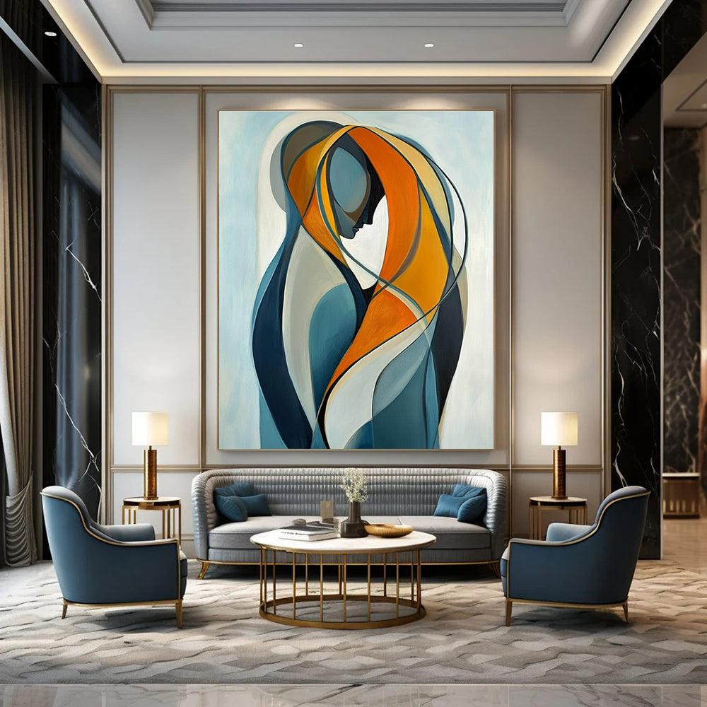 Large abstract painting of two intertwined figures in vibrant orange and yellow against a light blue background emphasizing connection and softness.STSC1143