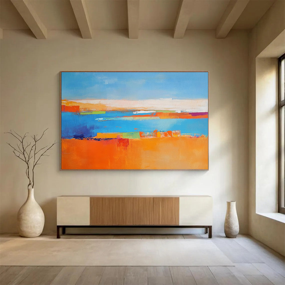 Large abstract painting featuring a soft blue background vibrant oranges geometric patterns warm yellows with green shapes and white figures symbolizing nature.SC060