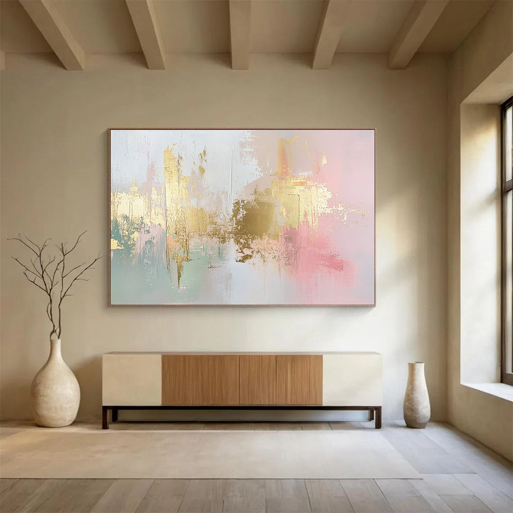 Large abstract painting in soft pink, white, and gold with hints of light green and neutral tones, featuring dynamic brush strokes and a modern art style.SC283