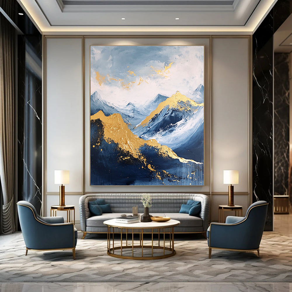 Large abstract painting featuring a golden mountain against a blue sky with white clouds and dark grey stone tones accented with gold.STSC013