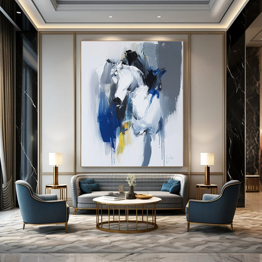 Large abstract painting in blue and white with dynamic brushstrokes reveals movement and emotion featuring elements of strength and energy.STSC036