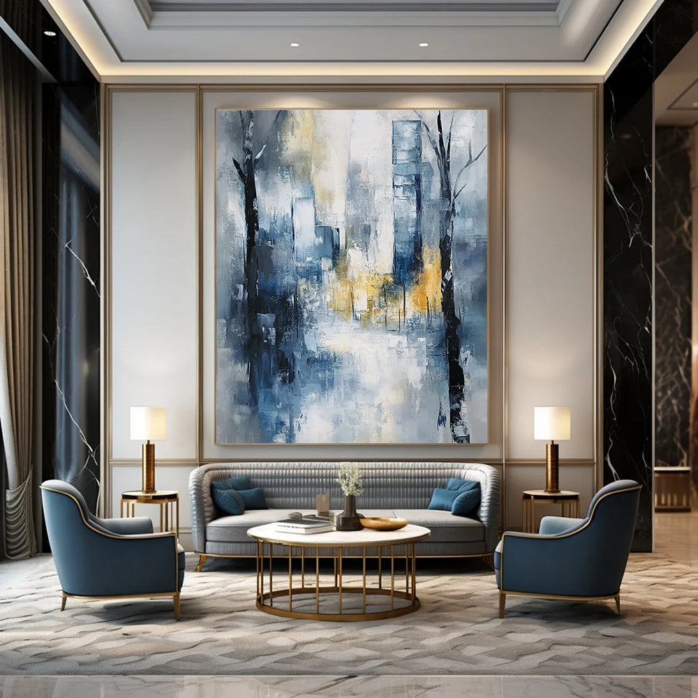 Large abstract painting of an urban cityscape in soft blue and grey tones with hints of yellow and white, featuring expressionist elements and a serene mood.STSC278