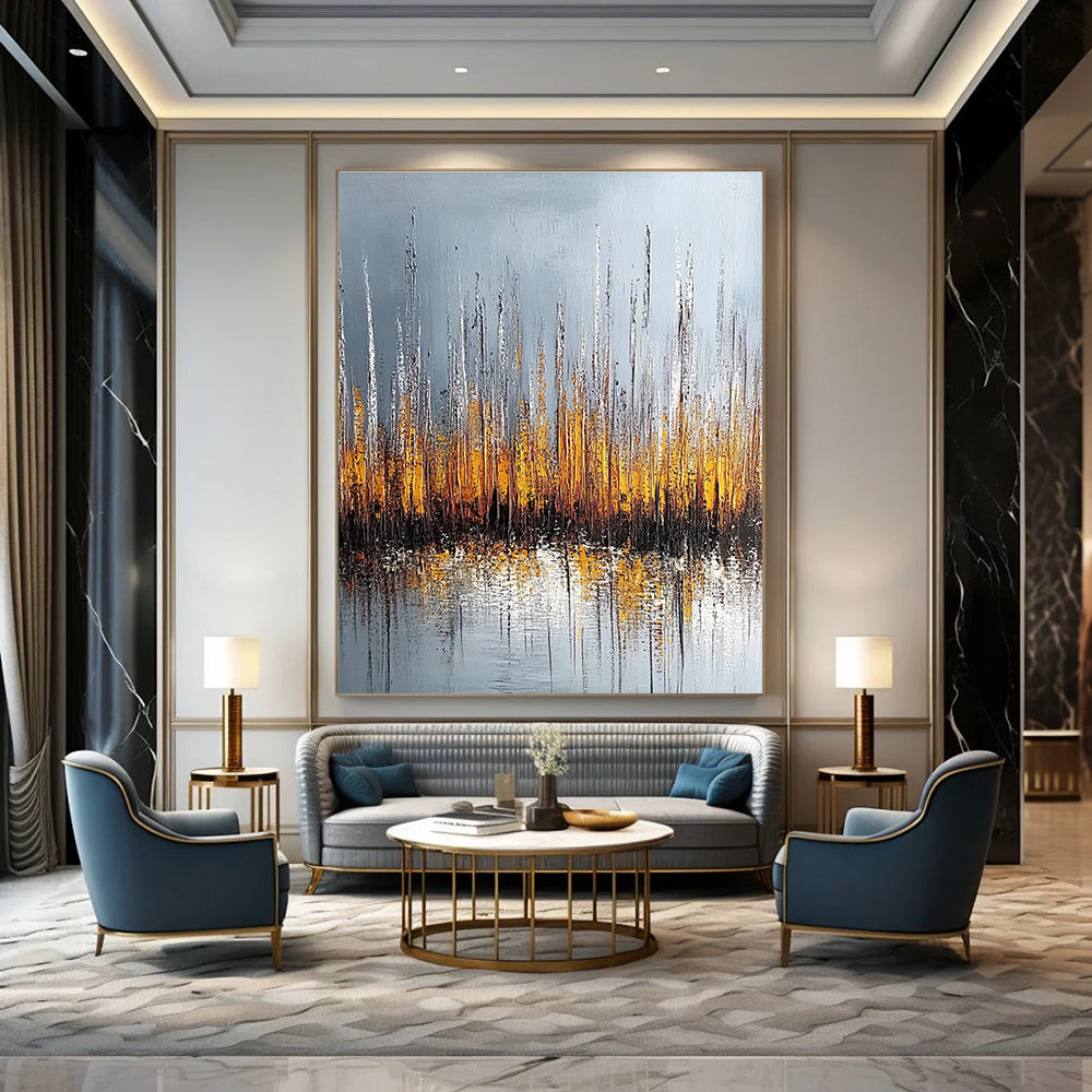 Large abstract painting of silver and gold reeds with reflections on water set against a muted gray background.STSC330