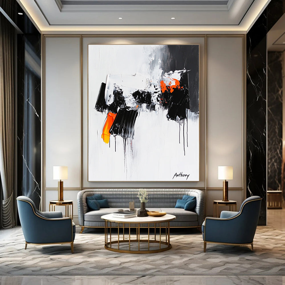 Large abstract painting featuring the word Anthony with black and orange dripping paint thick brush strokes and bold black shapes on a white background.STSC350
