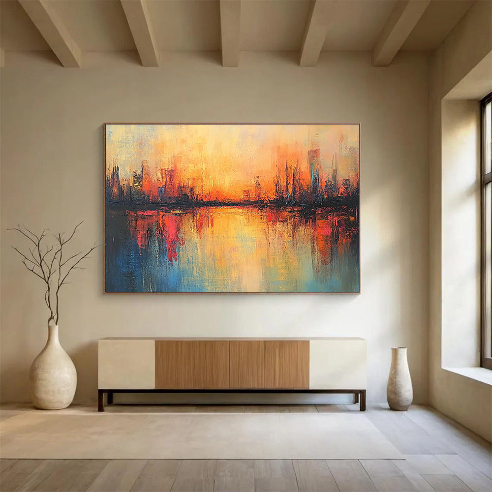 Large abstract painting featuring a cityscape in warm hues with soft brush strokes and reflections on calm waters, evoking a serene sunrise atmosphere.SC037